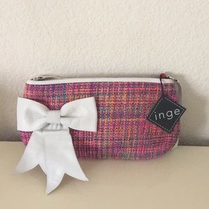 Clutch bag with leather bow